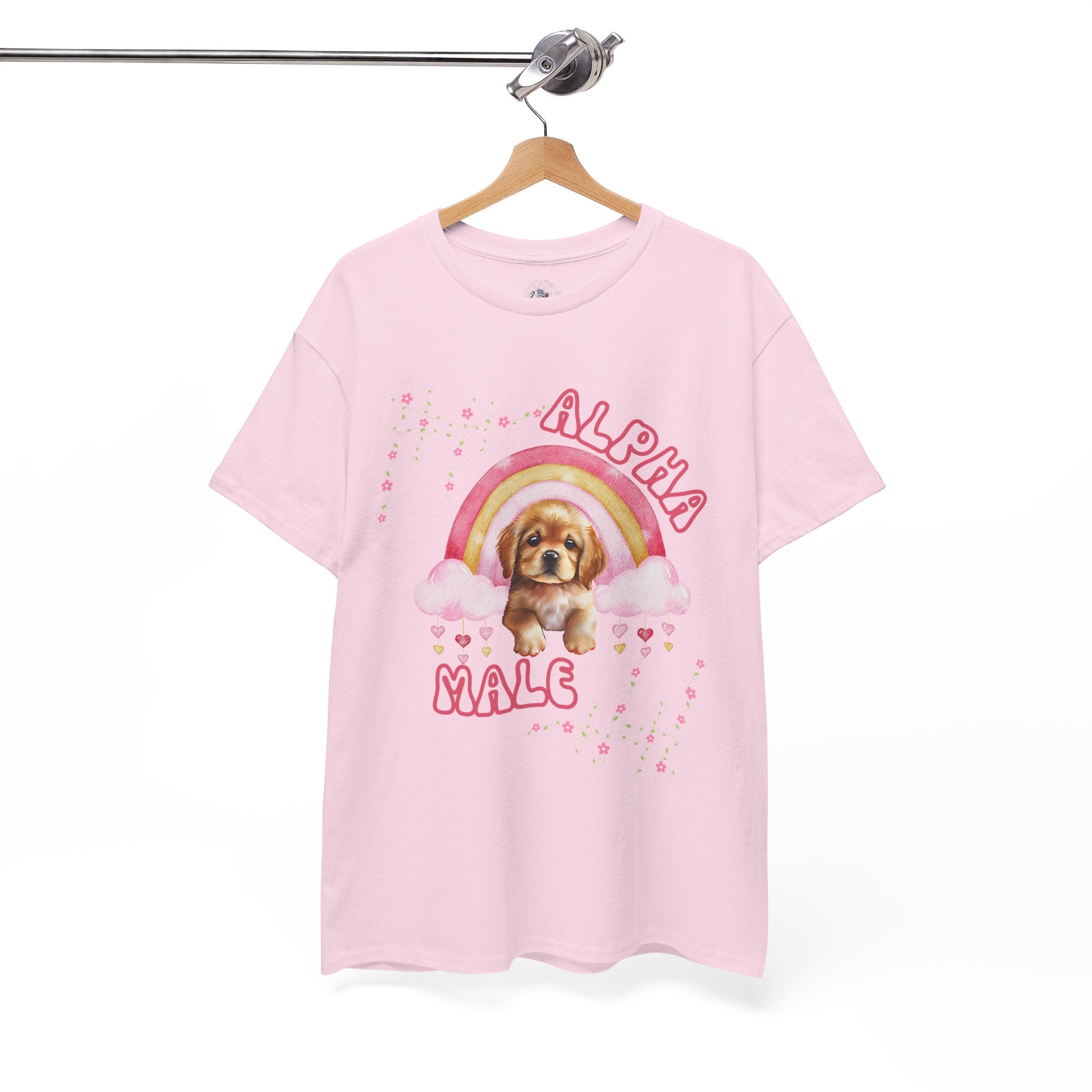 Pink t-shirt with a dog graphic and 'Alpha Male' text on a hanger against a white background