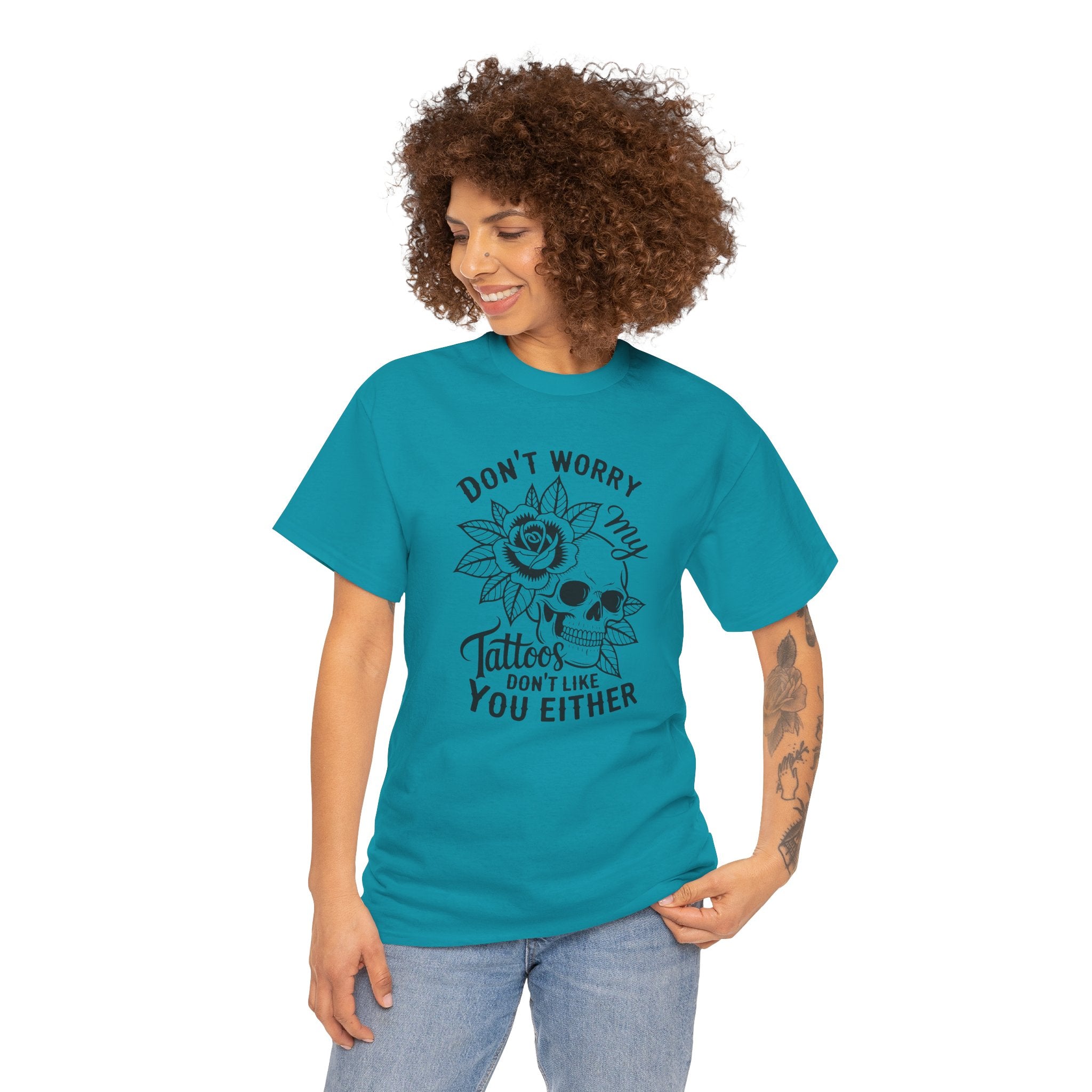 Woman wearing a teal t-shirt with a graphic design and text on a white background