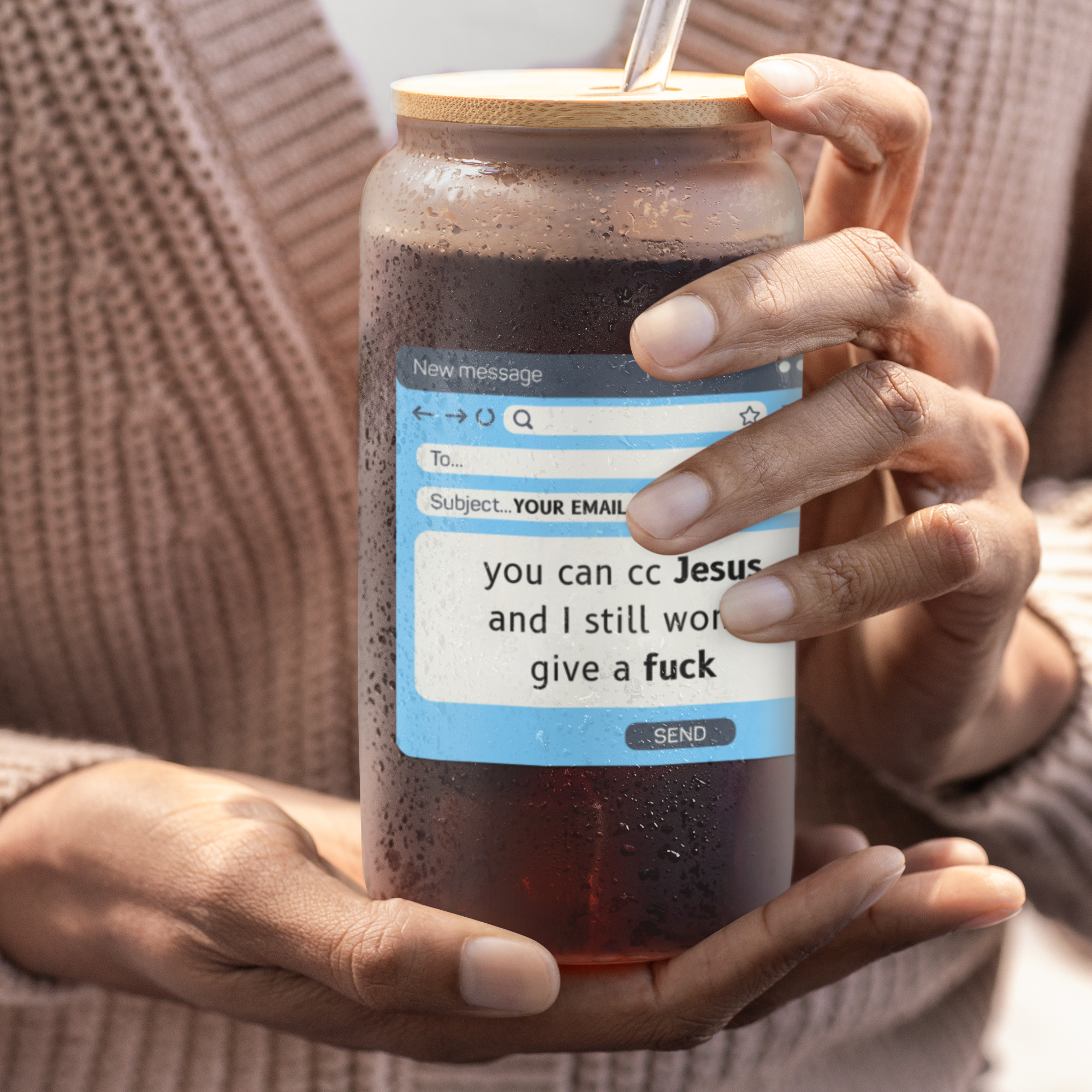 Person holding a glass with a wooden lid and straw, featuring a 'You Can CC Jesus and I Still Won't Give a Fuck' design.