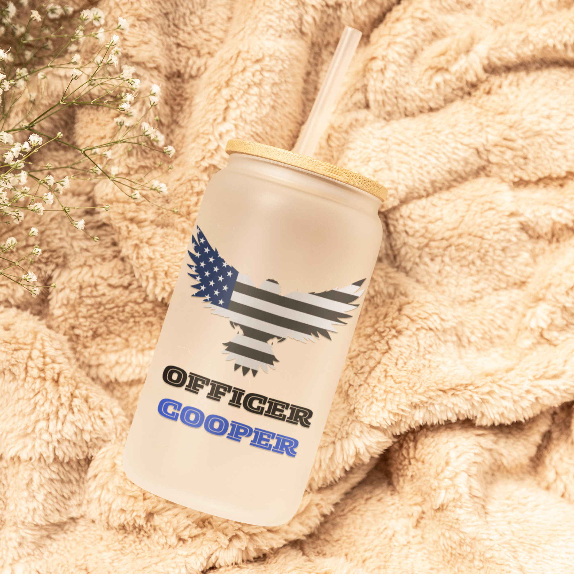 Tumbler with 'Officer Custom Name' design on a soft, beige fabric background