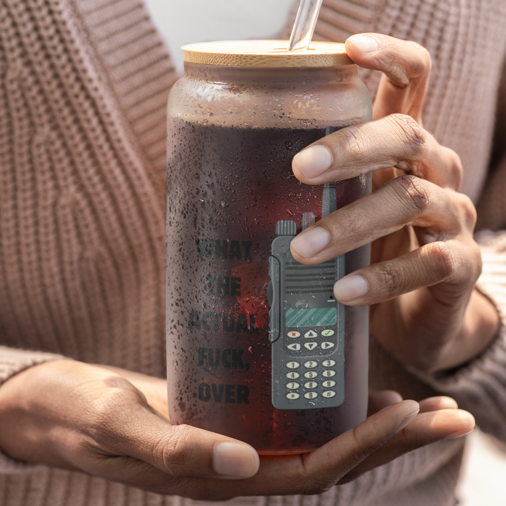 Person holding an offensive emt , police gift tumbler with a straw
