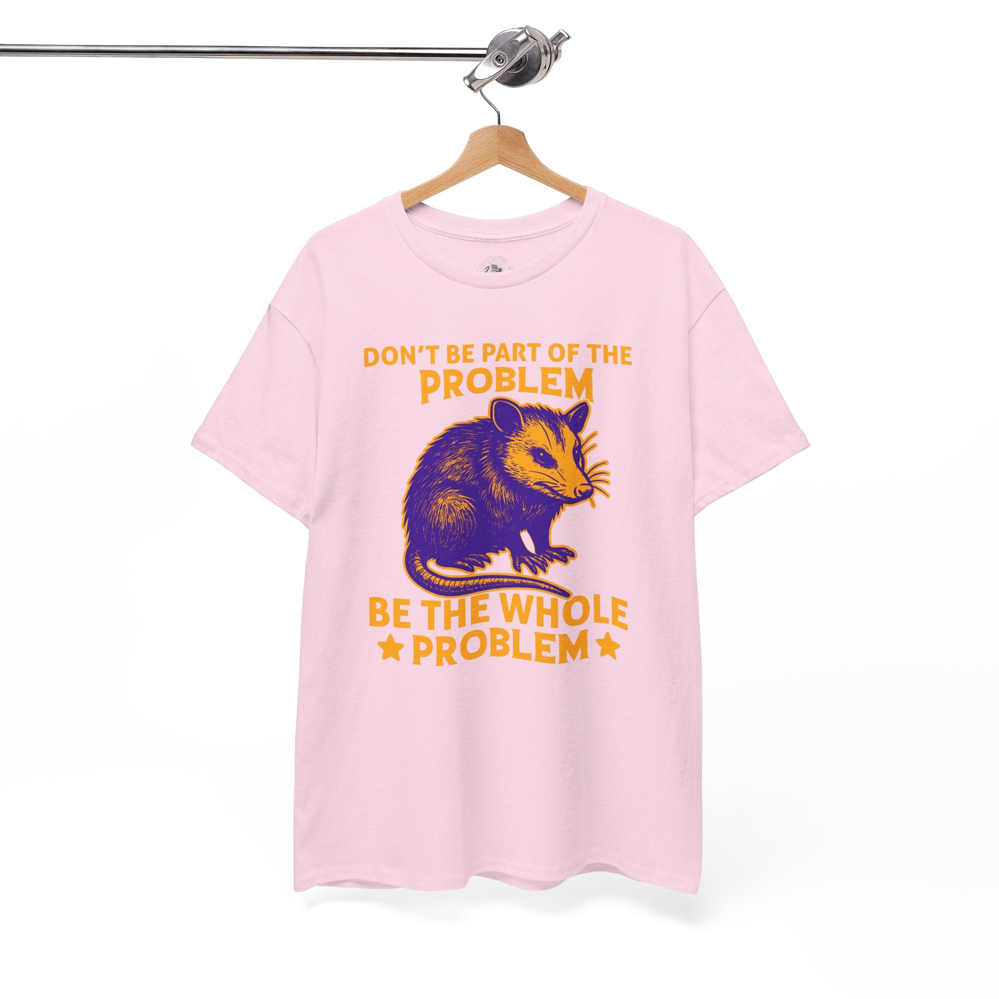 Pink t-shirt with a graphic of a hamster and text on a hanger against a white background