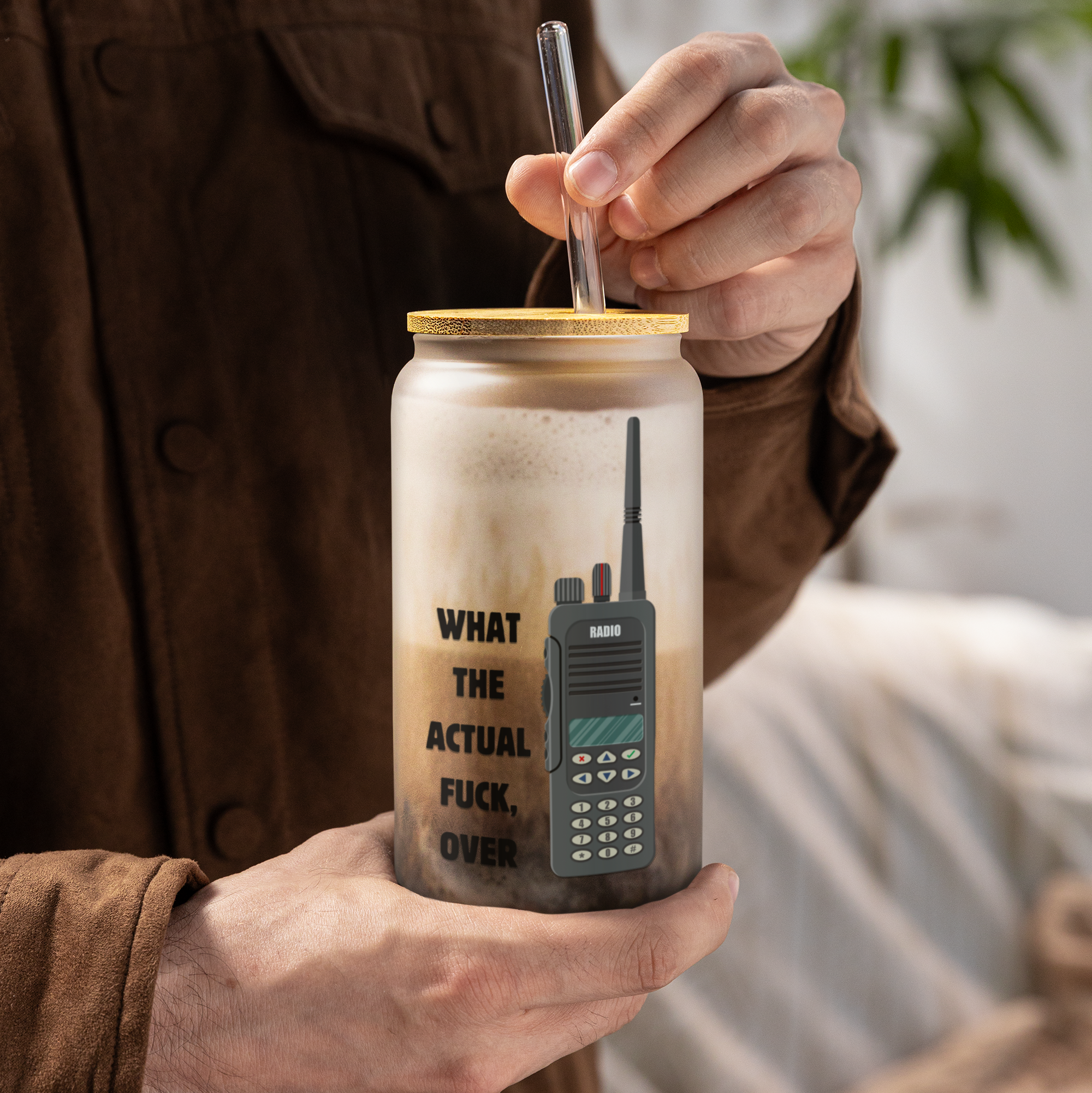 Person holding a jar with 'What The Actual Fuck Over' text.