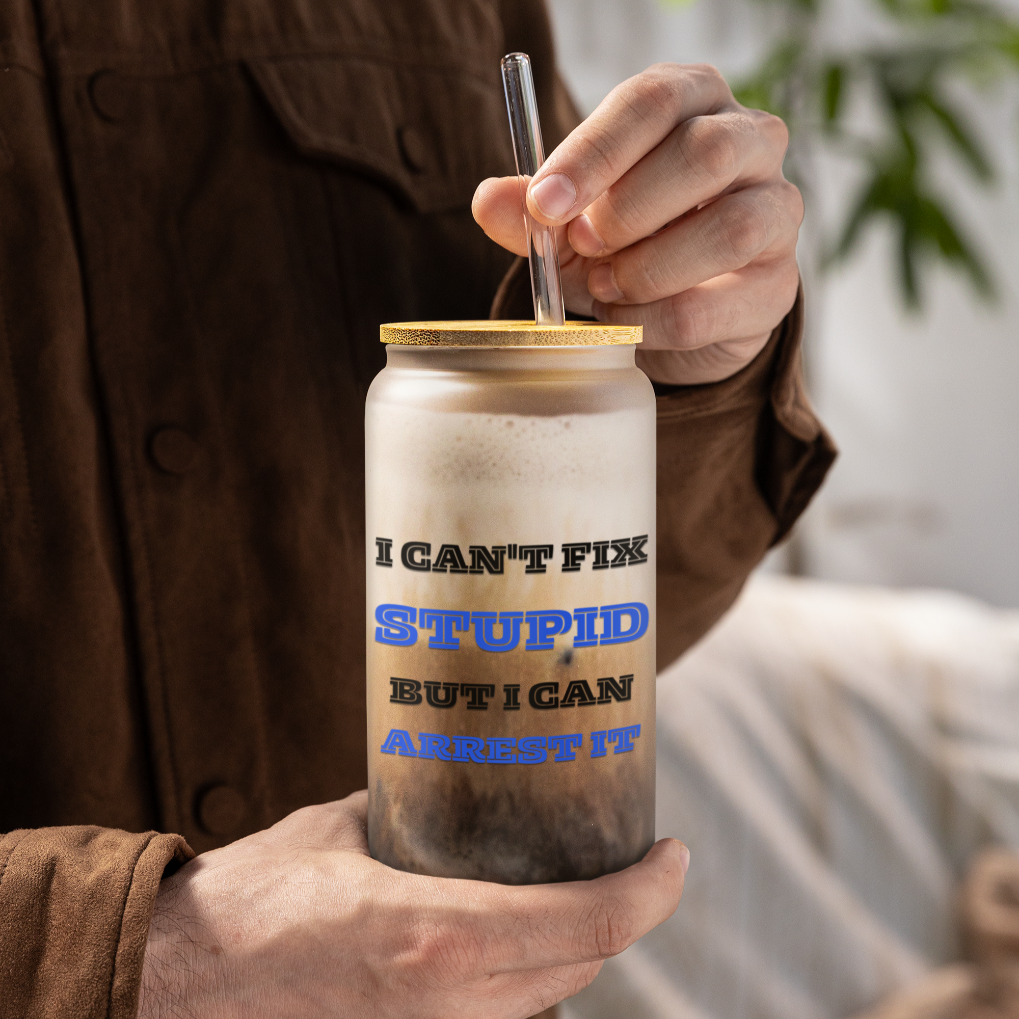 Person holding a insulated tumbler with humorous text design.